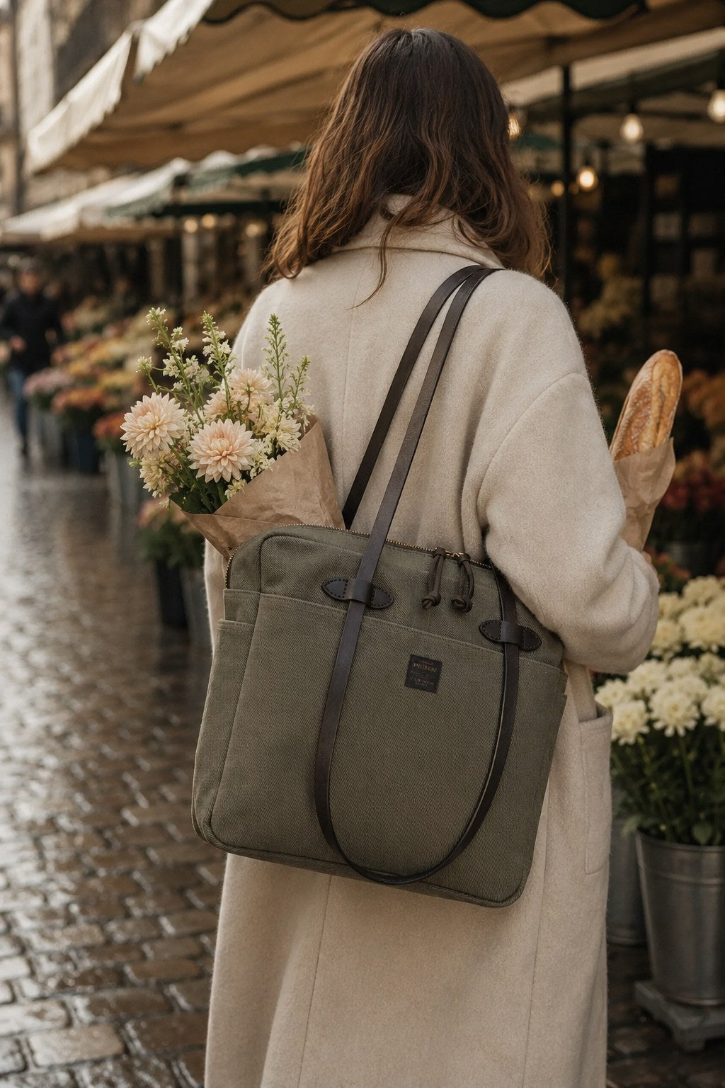 Carrying the Otter Green tote through an early flower market, dahlias leaning from the top