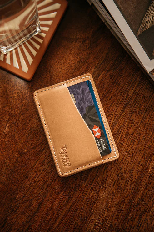 Natural Journeyman cardholder with a card on a dark wood table