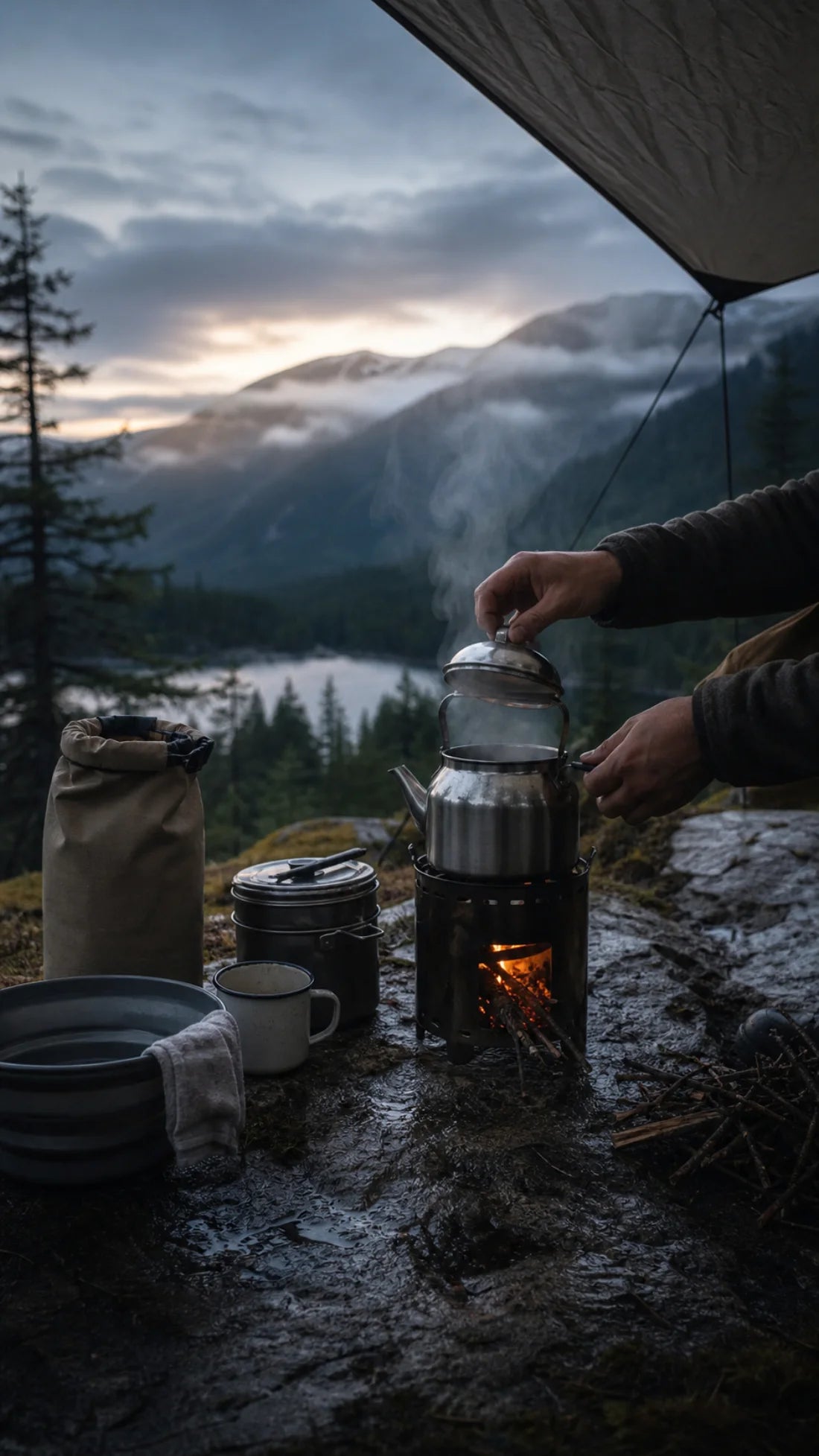 A controlled camp cooking system steaming after mountain rain