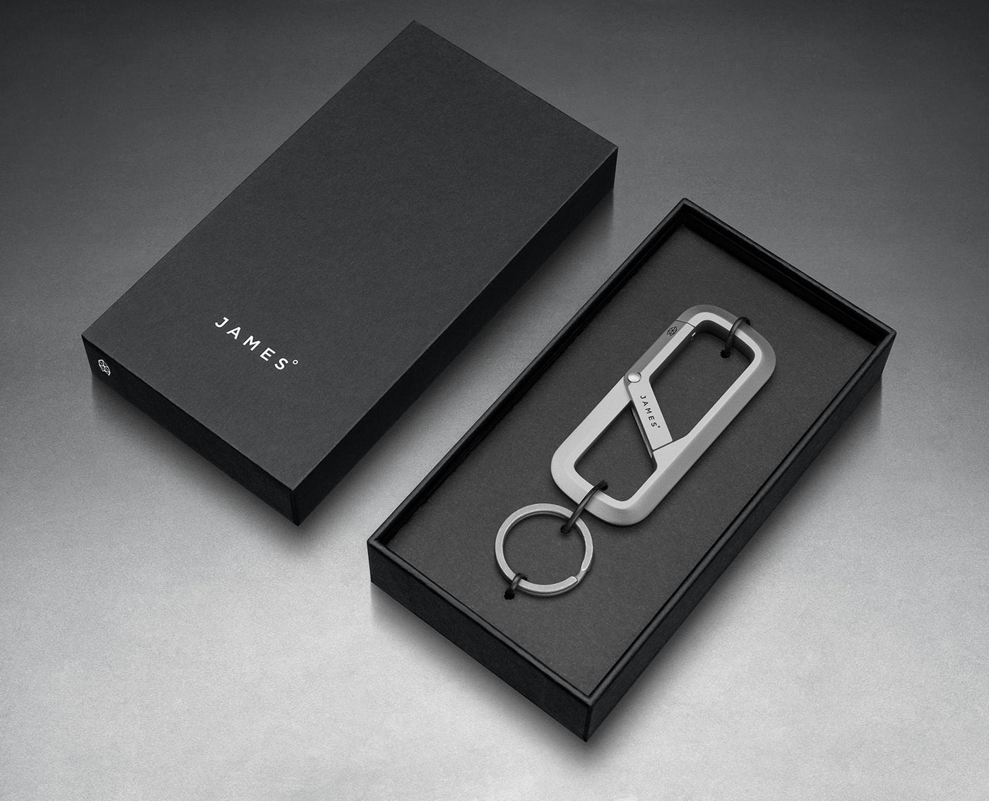 The Madison titanium key carrier and dark split ring in The James Brand presentation box