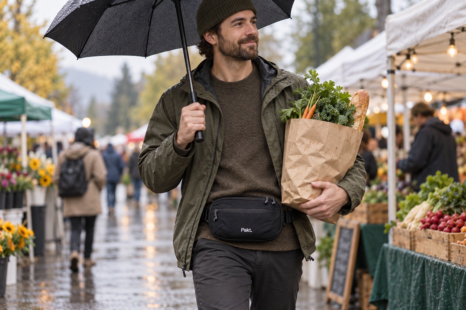 Black Pakt sling worn hands-free at a market after rain