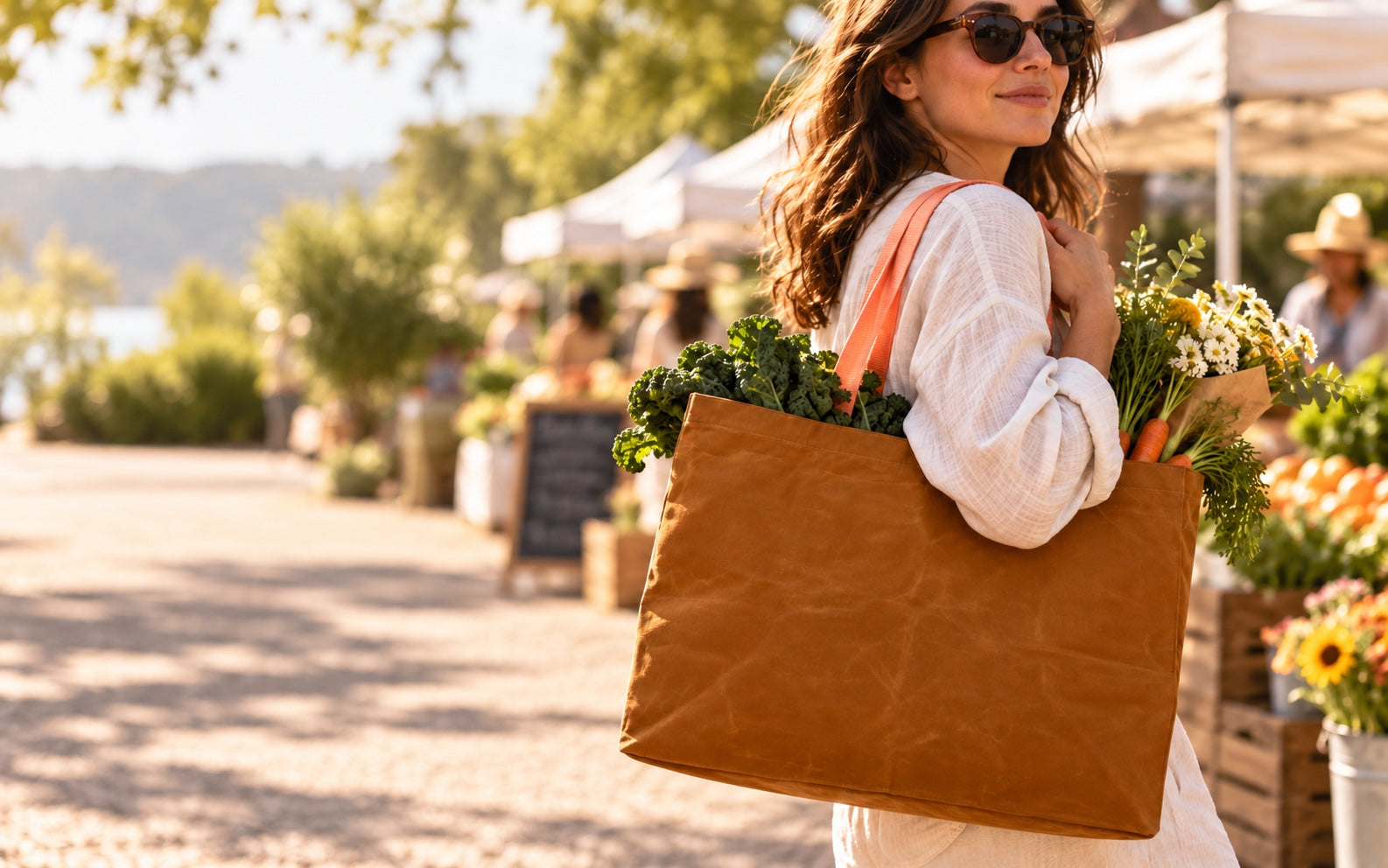 Transport Tote carried over the shoulder at a farmers market