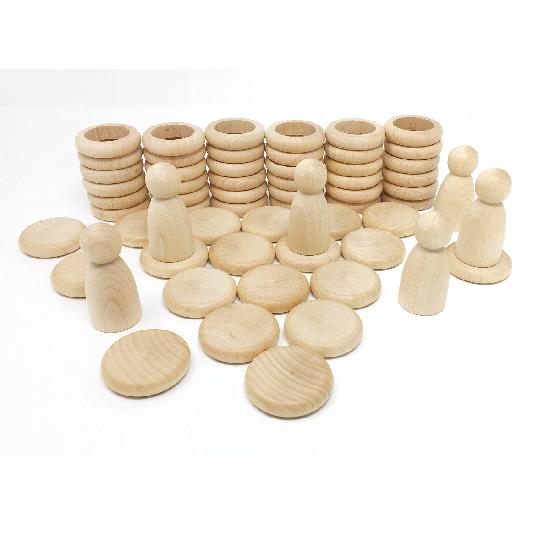 Grapat Nins, rings, and coins in natural wood, studio layout