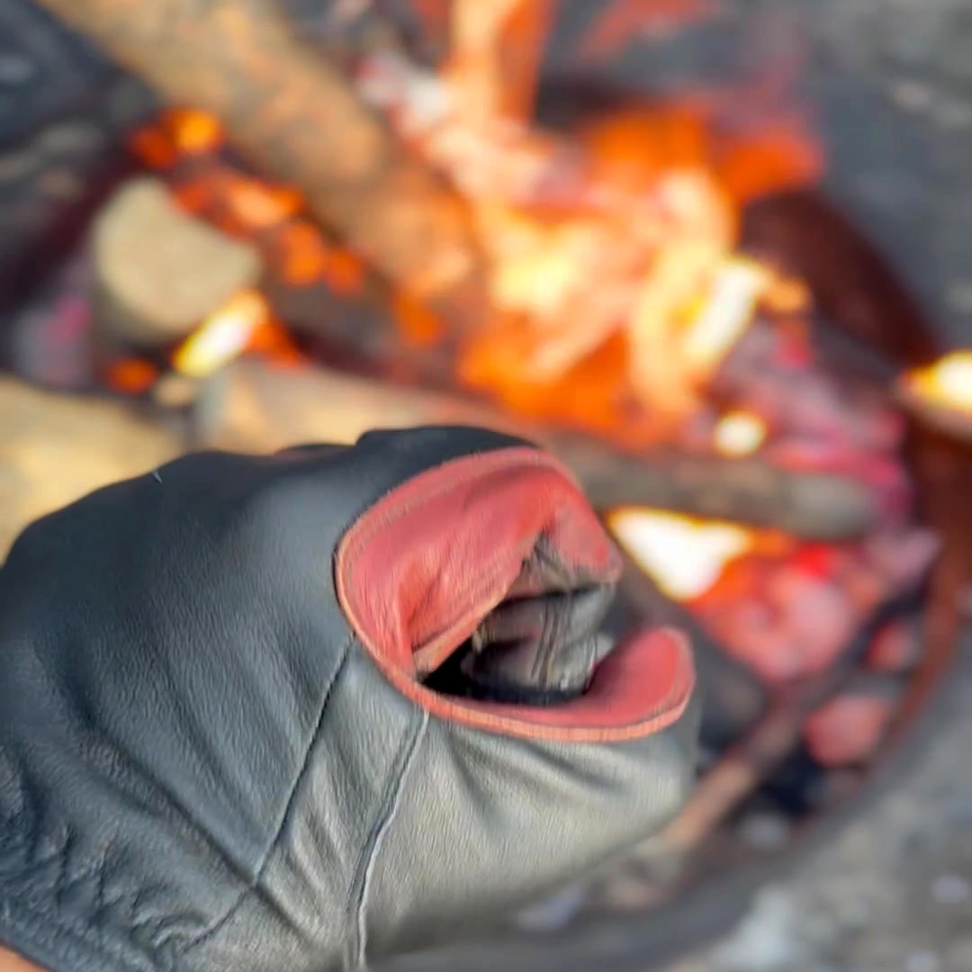 Real D8 Fire Glove handling coals beside an open fire