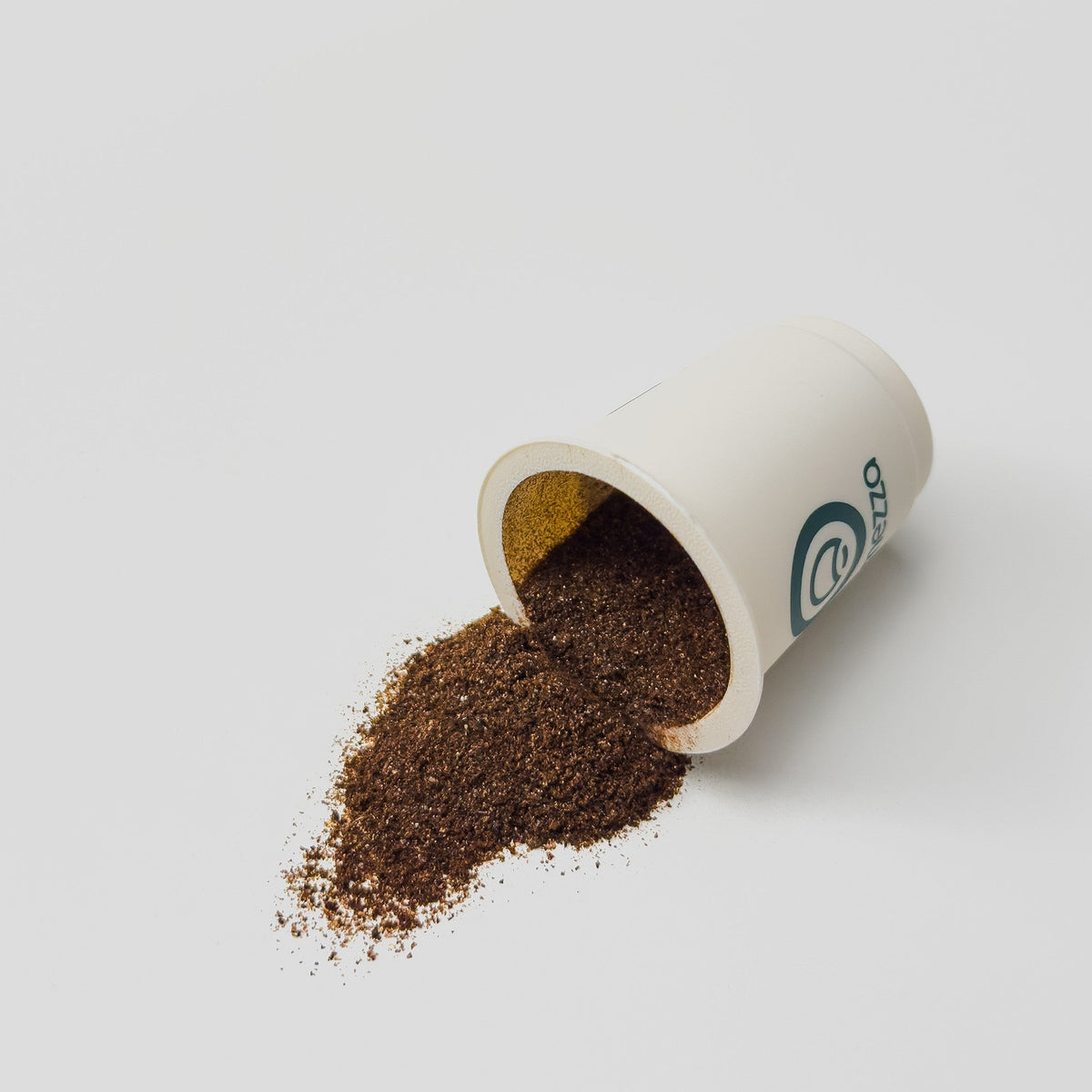 An opened Mezza single-serving coffee capsule