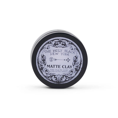 The Holy Black Matte Clay Hair Pomade — strong hold, matte finish, washes out easy