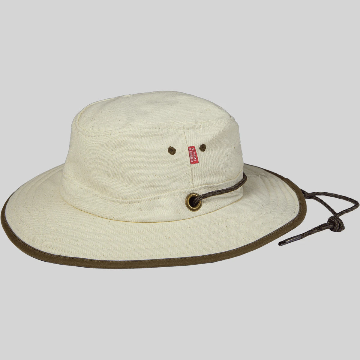 Natural Canvas Cruiser Hat showing its brim, crown, grommets, and paracord strap