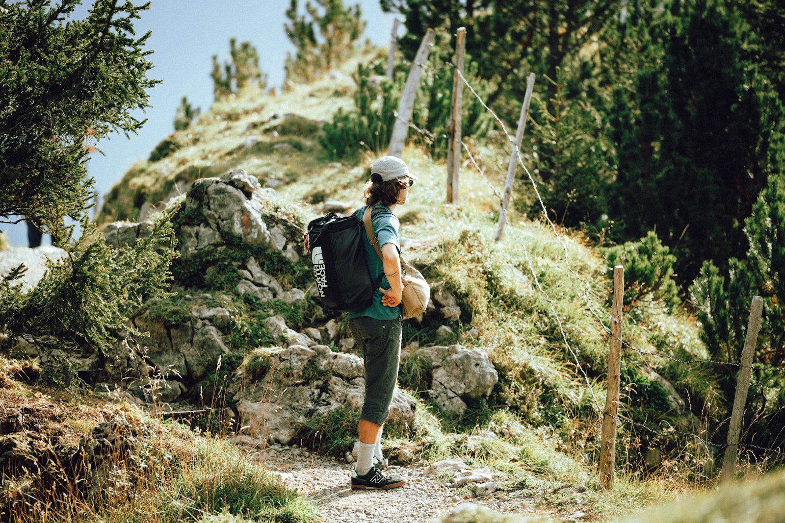 Hiker with backpack on a mountain trail