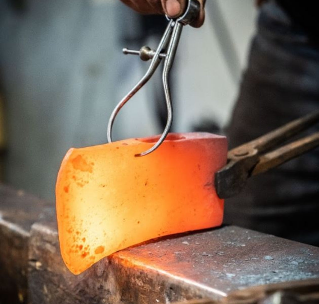 Checking an axe head at Brant & Cochran.