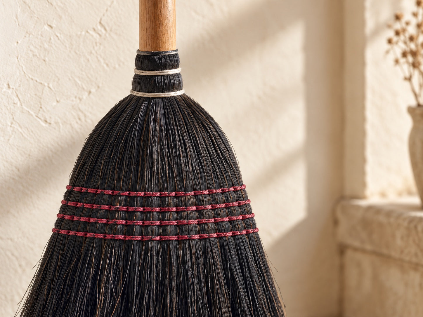 A close view of the black Everyday Broom fibers and stitching