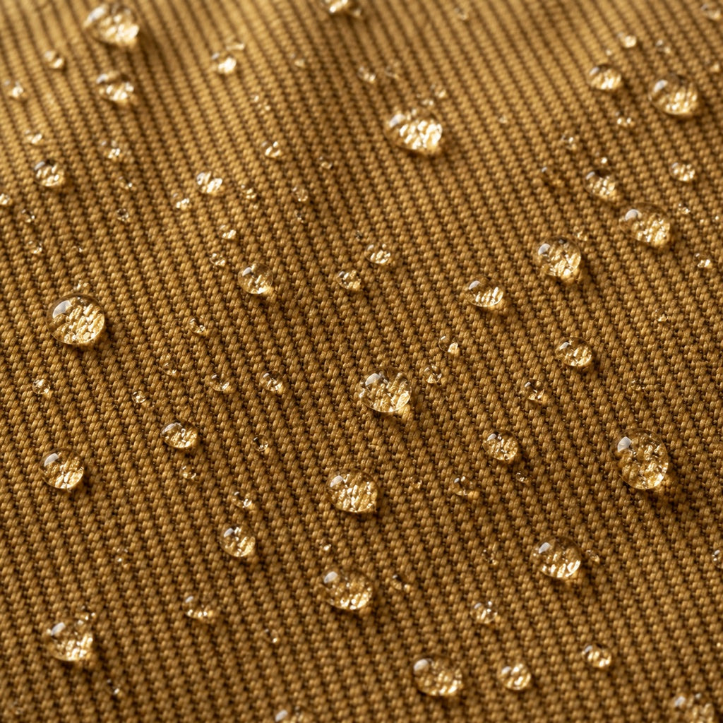 Macro of tan rugged twill canvas shedding beads of rain