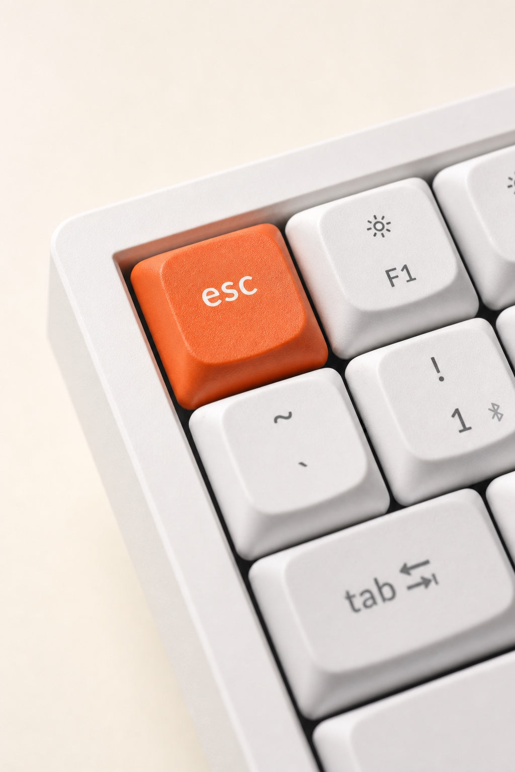 Macro of the K2 Max's coral-orange Esc keycap.