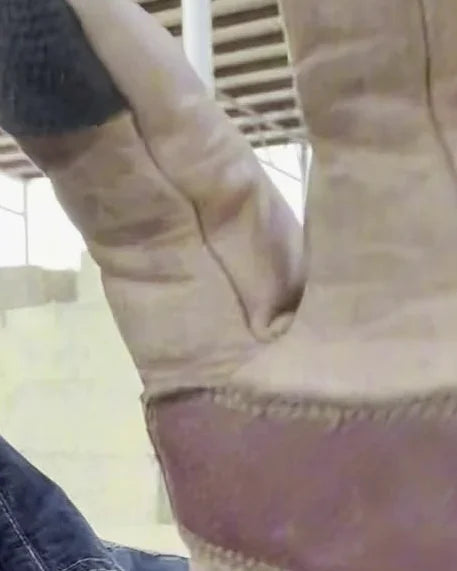 A broken-in glove, soft at every bend, palm heel worn smooth