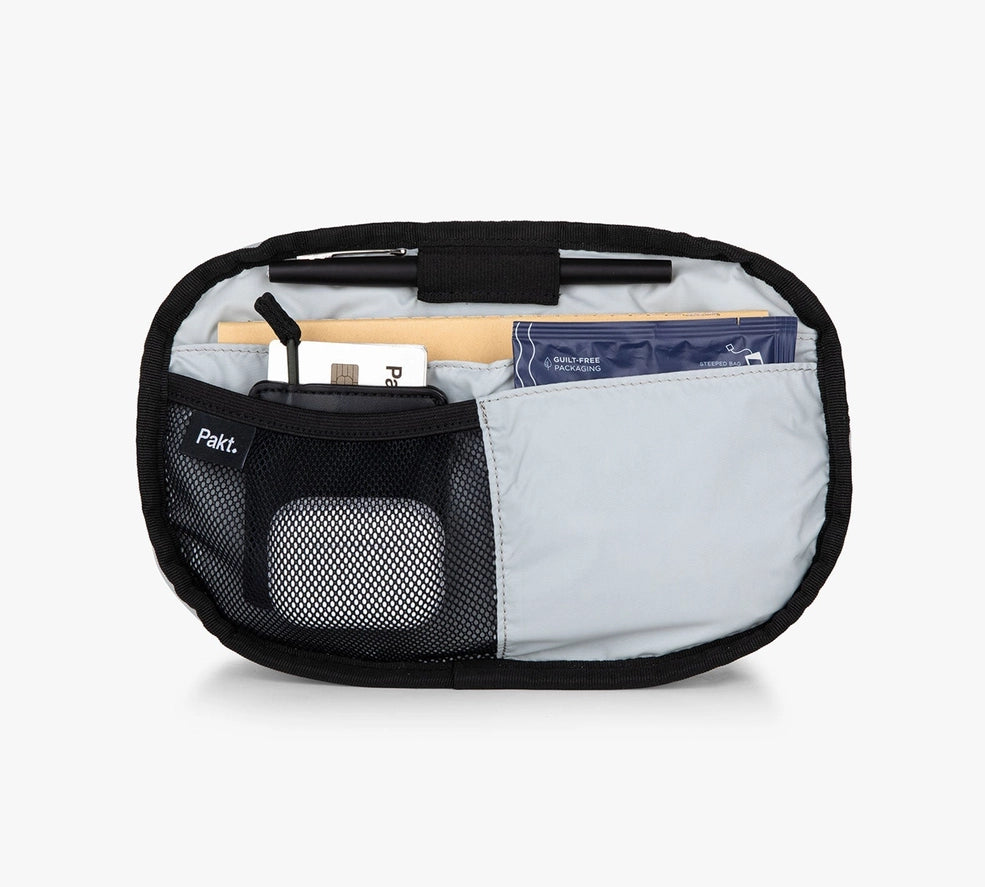 Open Pakt Everyday 3L Sling showing organized interior pockets