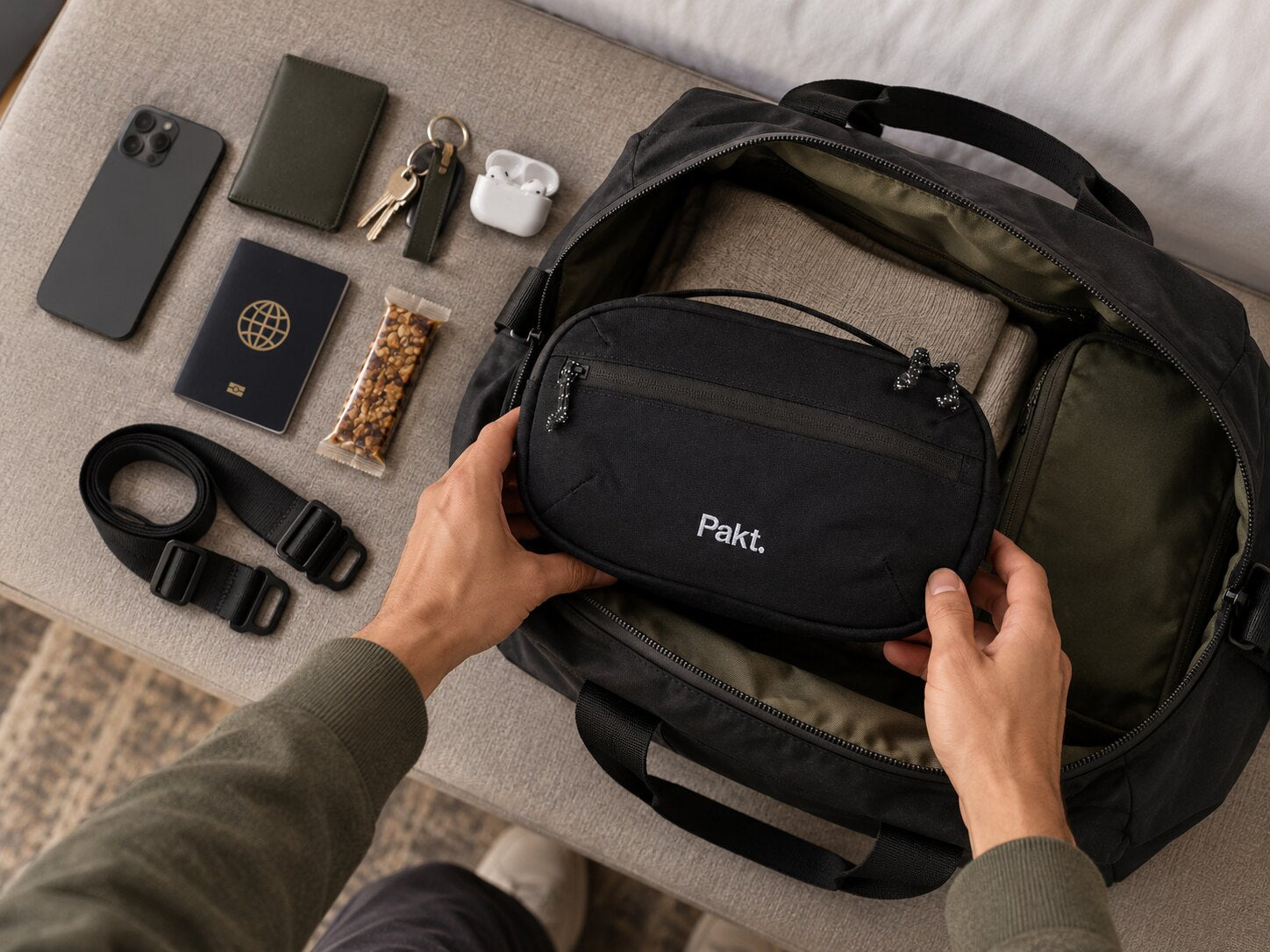 Black Pakt sling with its strap removed, used as a travel organizer